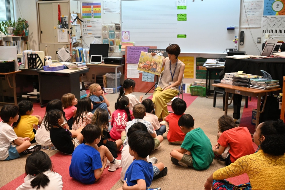 Teacher reading to classroom of students